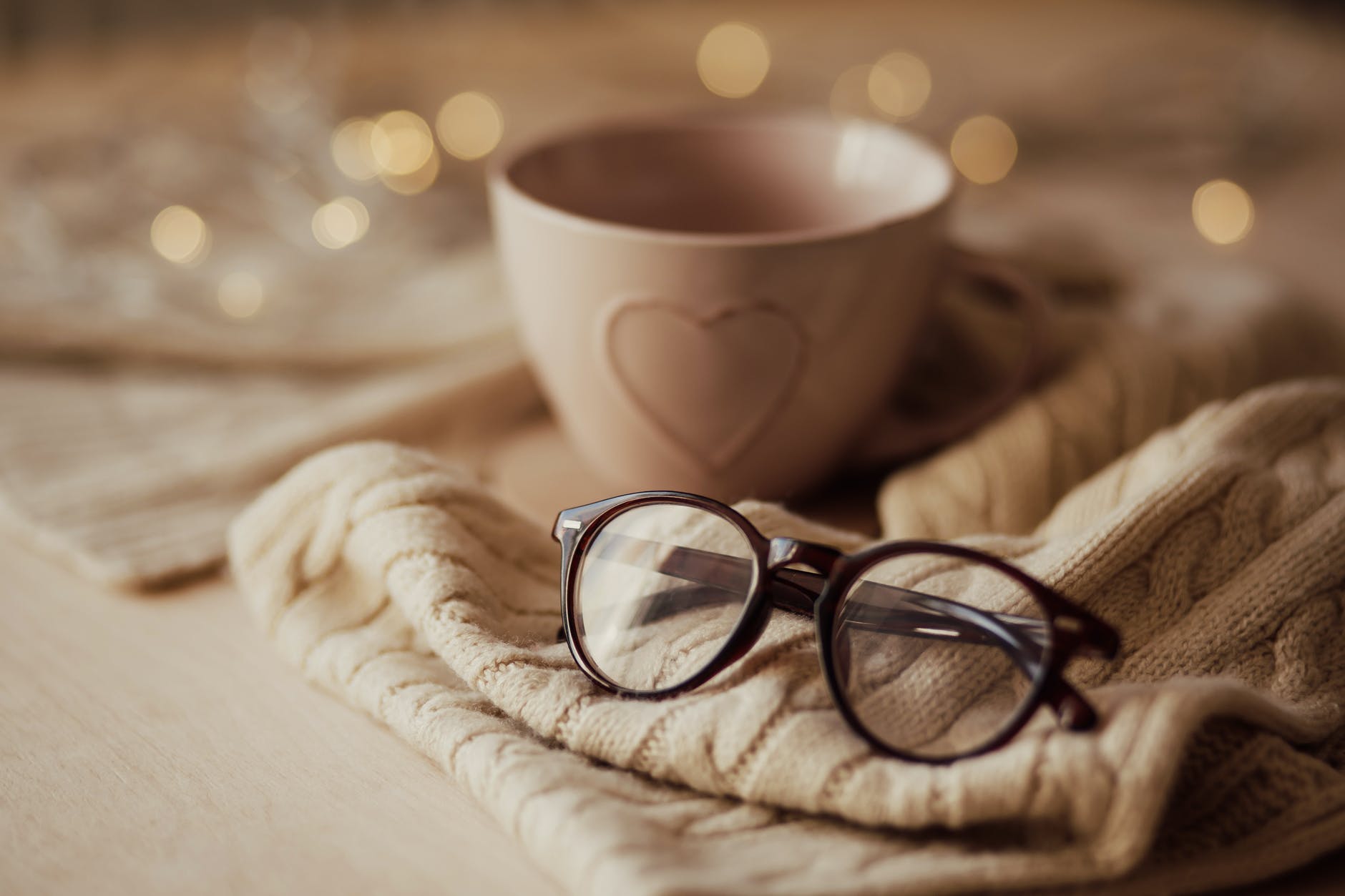 eyeglasses with mug on warm scarf